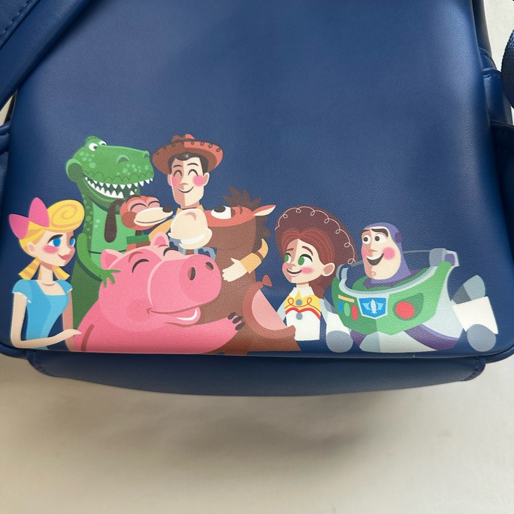 LOUNGEFLY PIXAR MOMEMT TOY STORY WOODY, BO PEEP, & TOYS BACKPACK - Picture 5 of 9